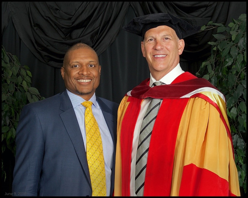 University of Calgary alumnus Ian Minnifee (BA'94)and Jay Triano (LLD'16)