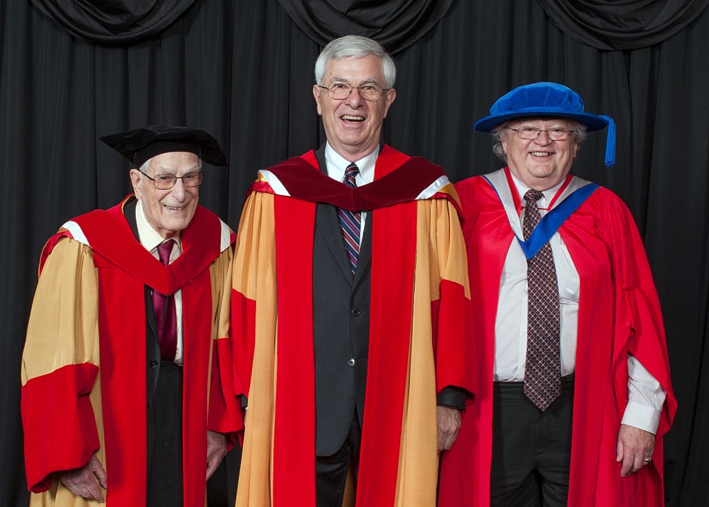 Dr. Richard Guy (L) and Dr. Robert Woodrow (R) celebrate with Dr. William Pulleyblank as he is conferred with an honorary degree at UCalgary's Convocation 2017 